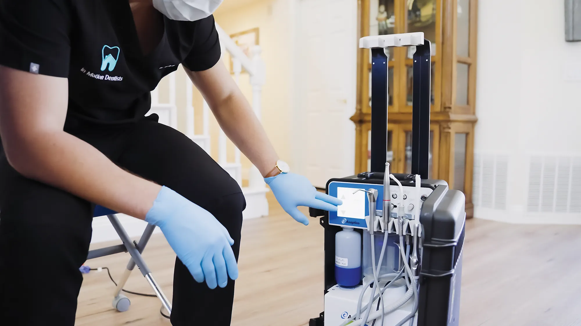 Dr. Banner using the Aseptico GO ultra Portable dental system