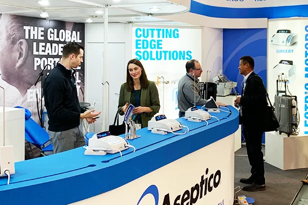 A photo of our sales team at a dental convention with our aseptico dental motors on display
