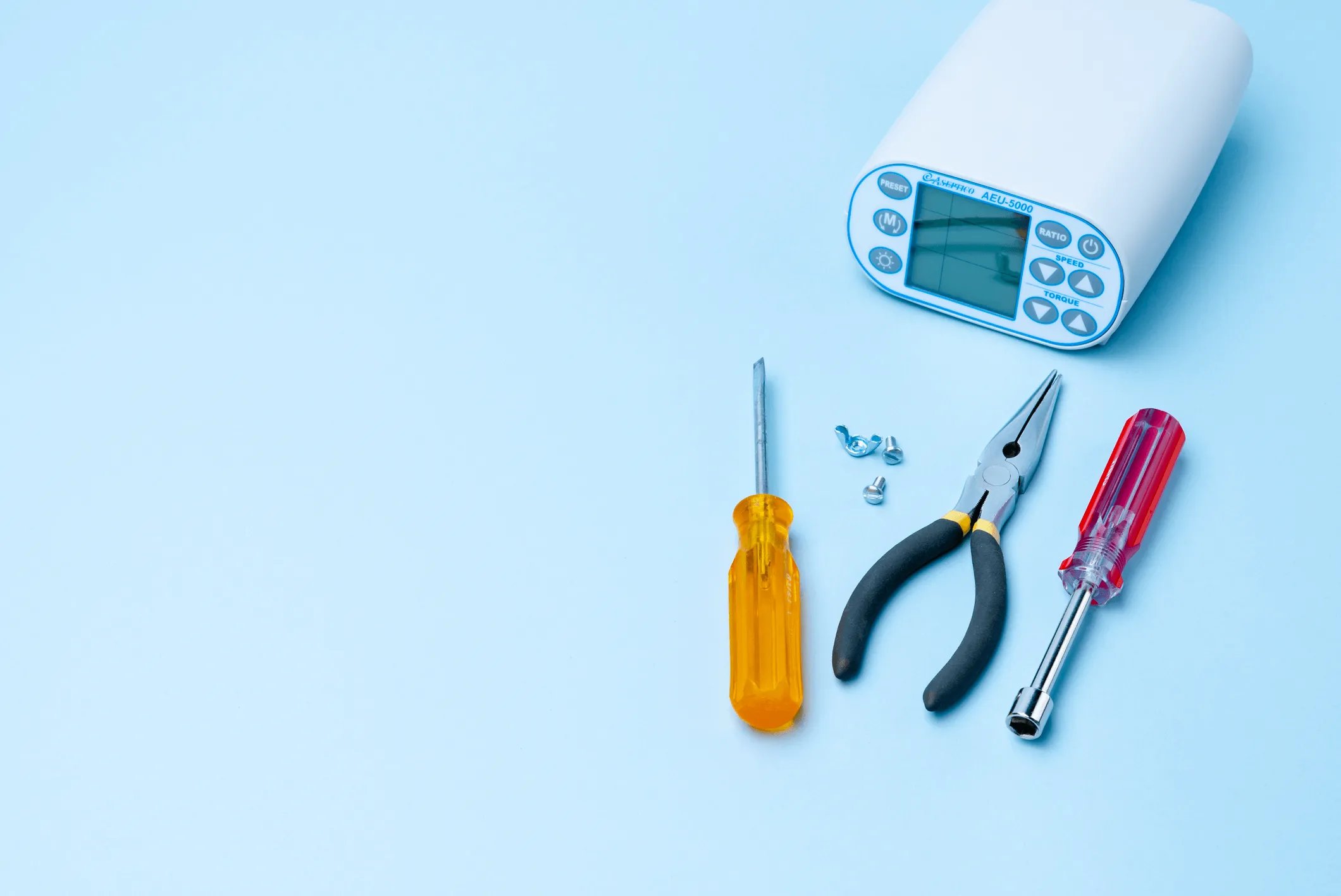 decorative photo banner of a dental motor surrounded by common tools