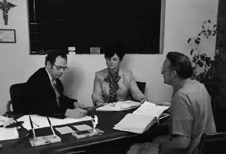 Old photo of Doug and Edyie in a meeting